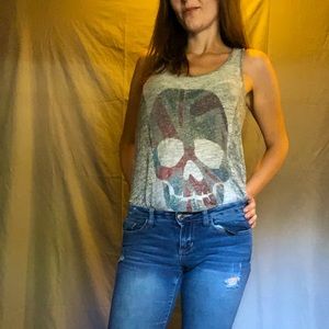 Hi I’m selling a skull tank top wool fabric the size is Large the color is gray